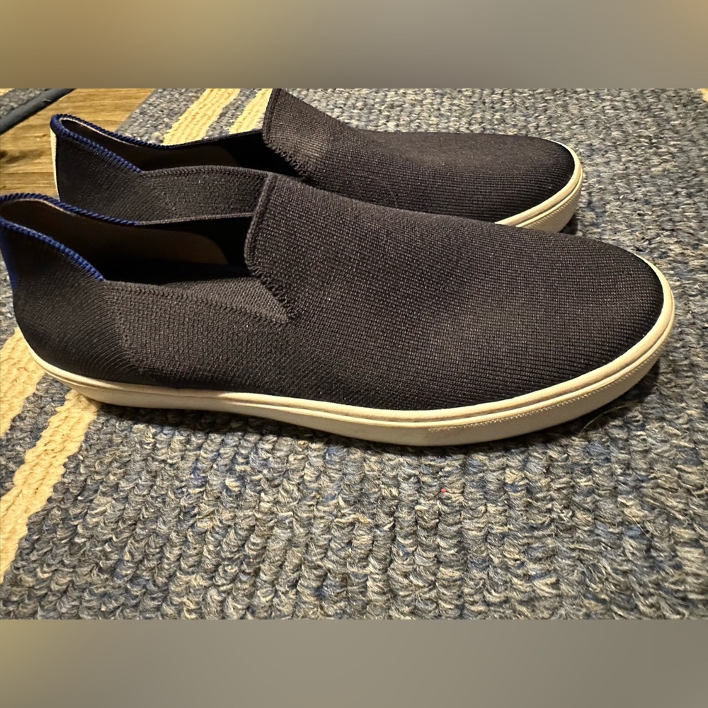 Rothy’s sneakers size 10.5 Navy- used very good. Only wear is on the soles.